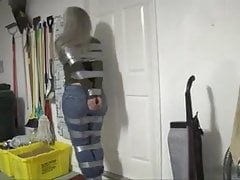 Taped up girl hops around house